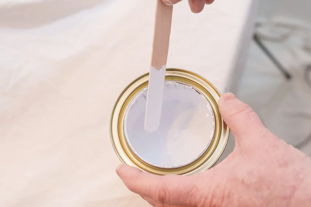 paint pot with mixing stick